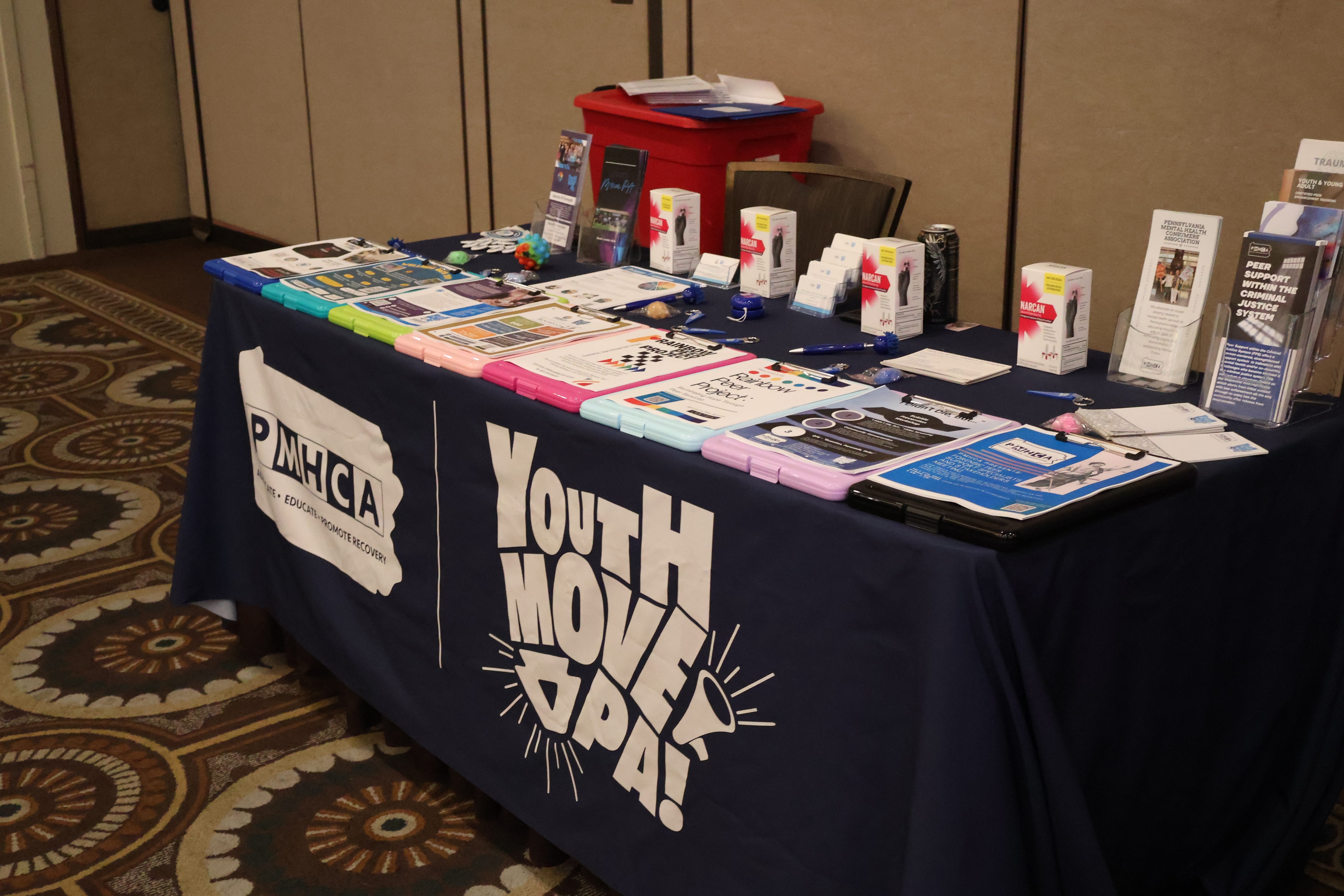 PMHCA and Youth Move PA exhibitor booth with resource materials